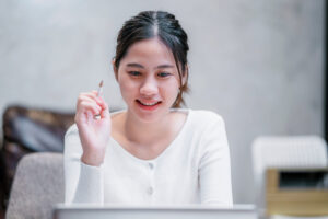 Asian girl student studying online