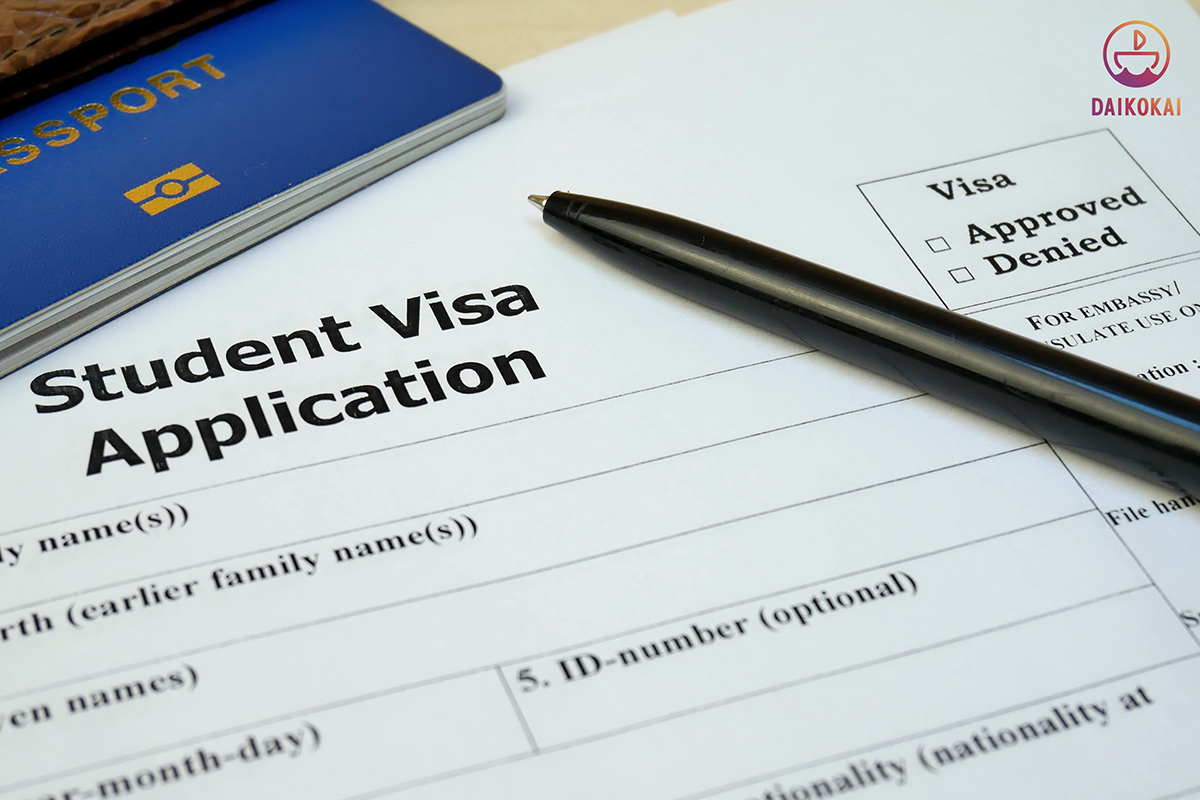 Student visa application form with a pen above